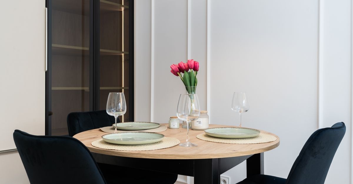 Gather Round: Designing a Stylish Dining Room Around a Round Wooden Table
